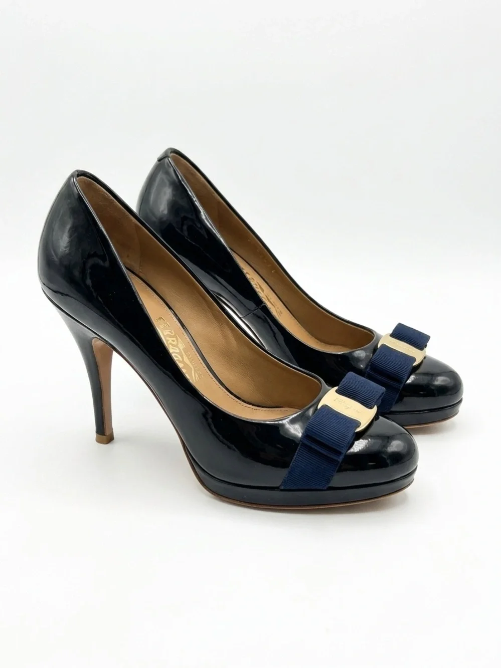 Salvatore Ferragamo Navy Patent Pumps with Navy Bow and Gold Plaque